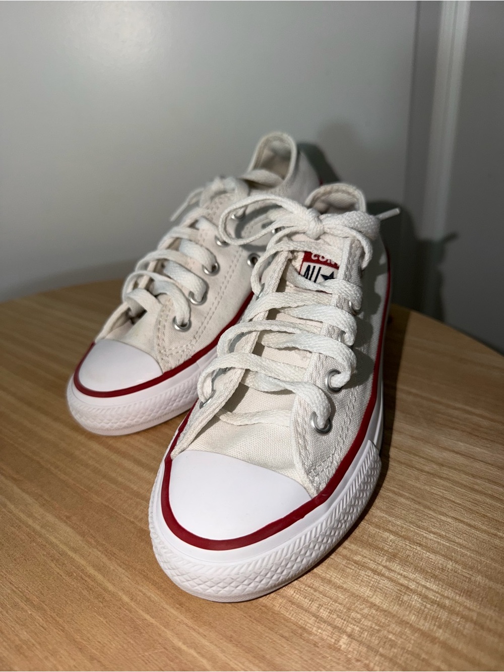 Converse Low Top Canvas Sneakers in White with Red Trim